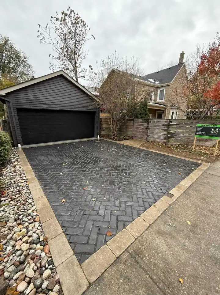 After: herringbone interlock driveway at detached garage